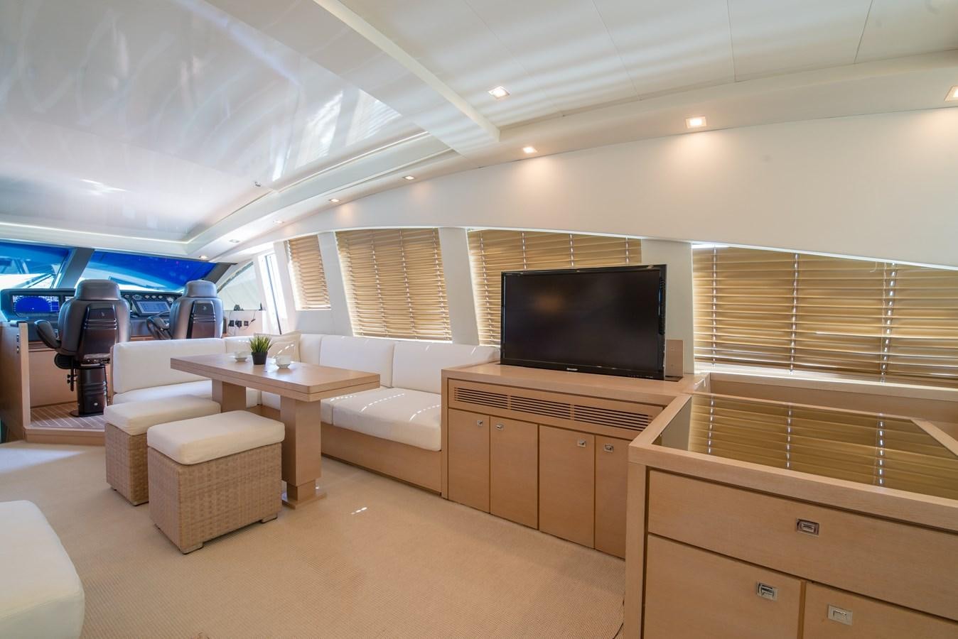 a room with a tv and a table aboard SUN ANEMOS Yacht for Sale