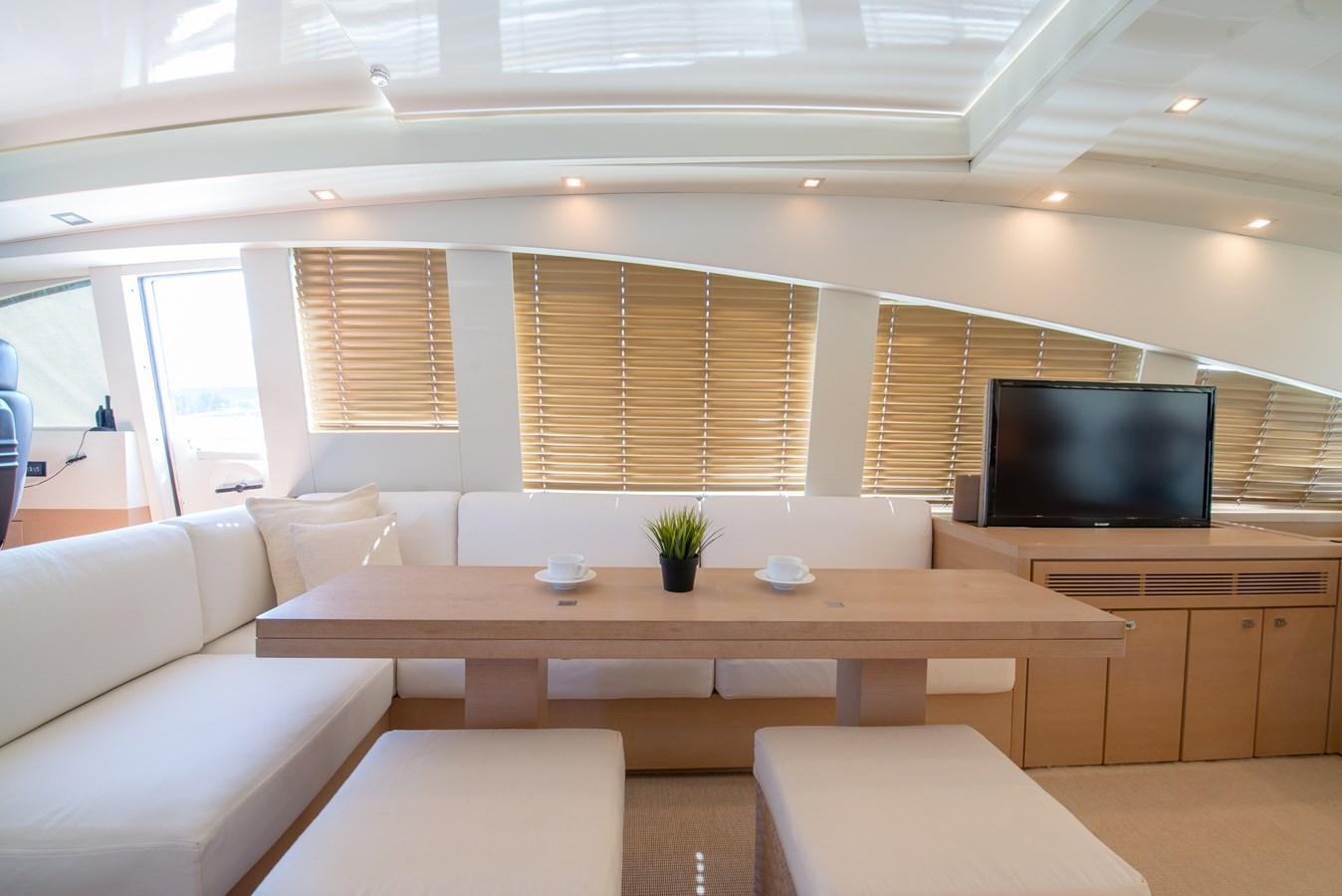 a room with a tv and couches aboard SUN ANEMOS Yacht for Sale