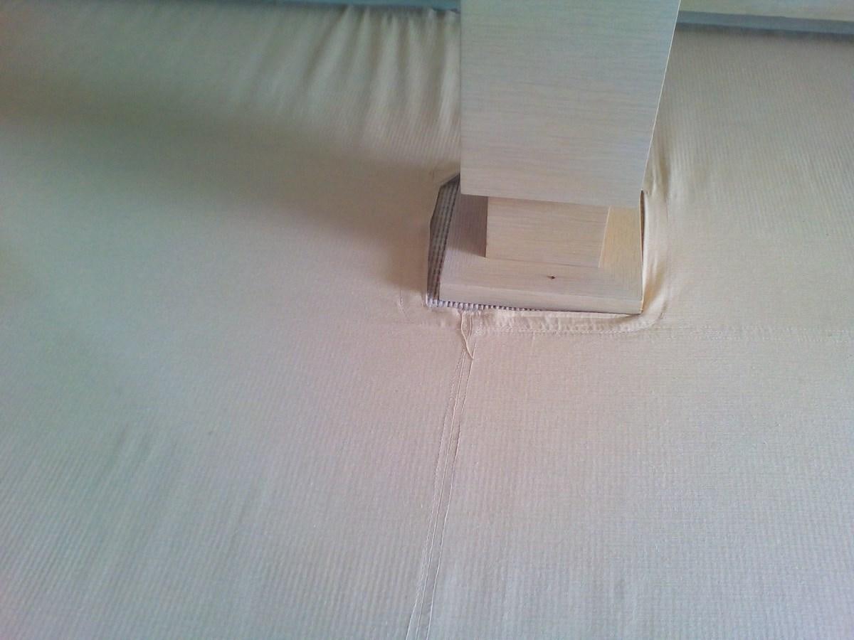 a white box on a bed aboard SUN ANEMOS Yacht for Sale