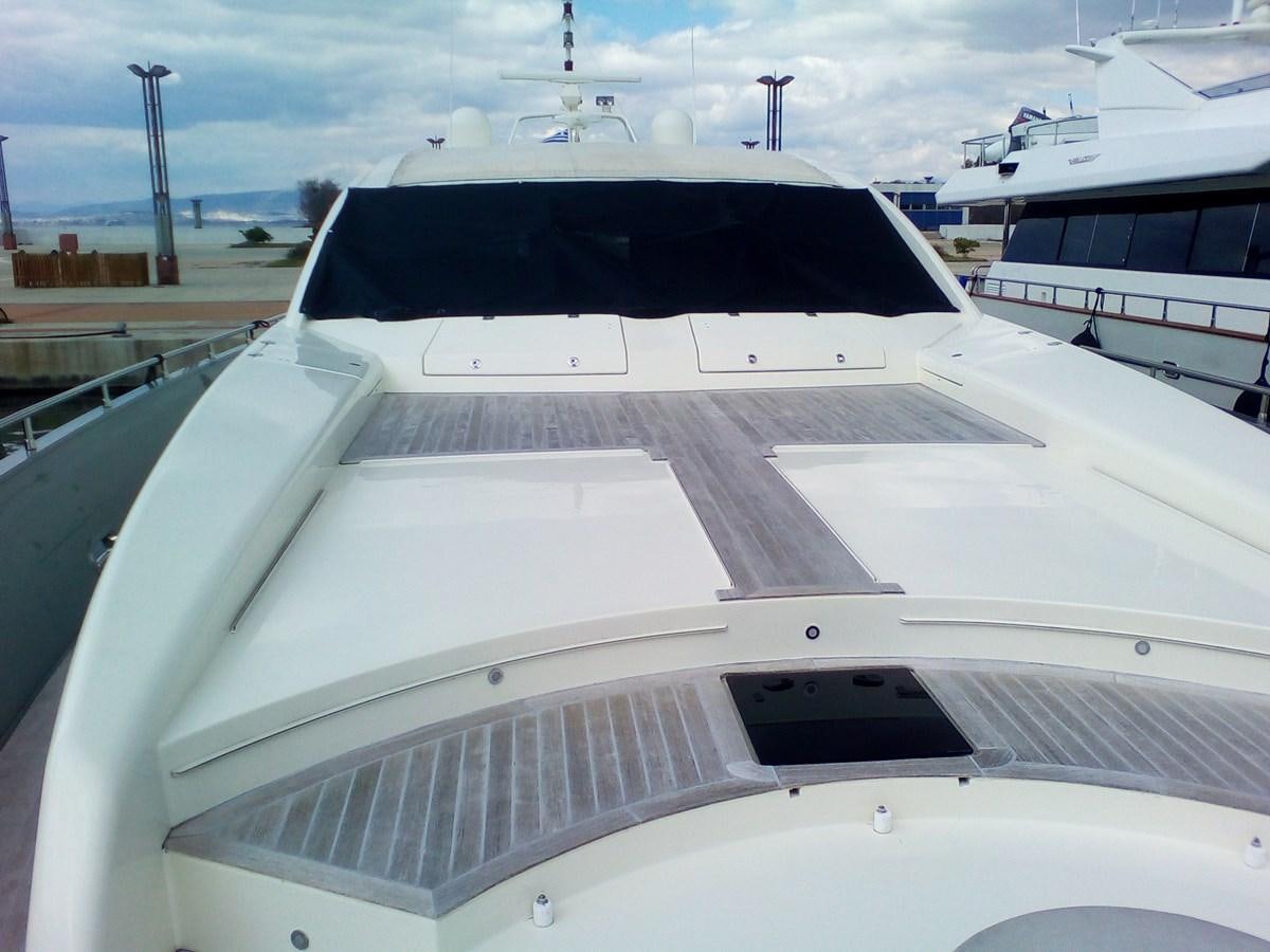 a white yacht in a harbor aboard SUN ANEMOS Yacht for Sale