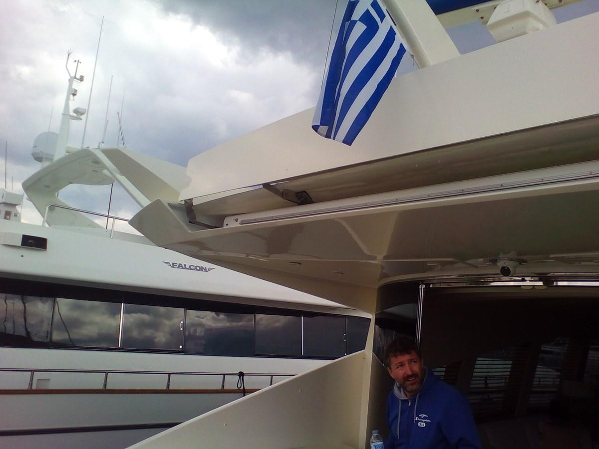 a man standing next to a plane aboard SUN ANEMOS Yacht for Sale