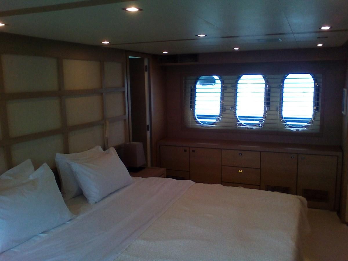 a bed with white sheets aboard SUN ANEMOS Yacht for Sale