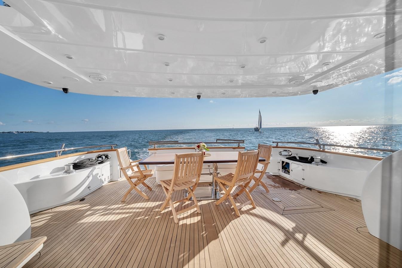 a room with a table and chairs aboard DOMINIC Yacht for Sale