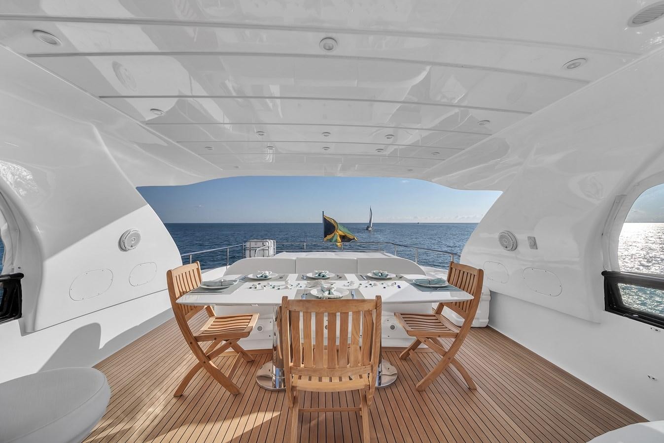 a room with a table and chairs aboard DOMINIC Yacht for Sale