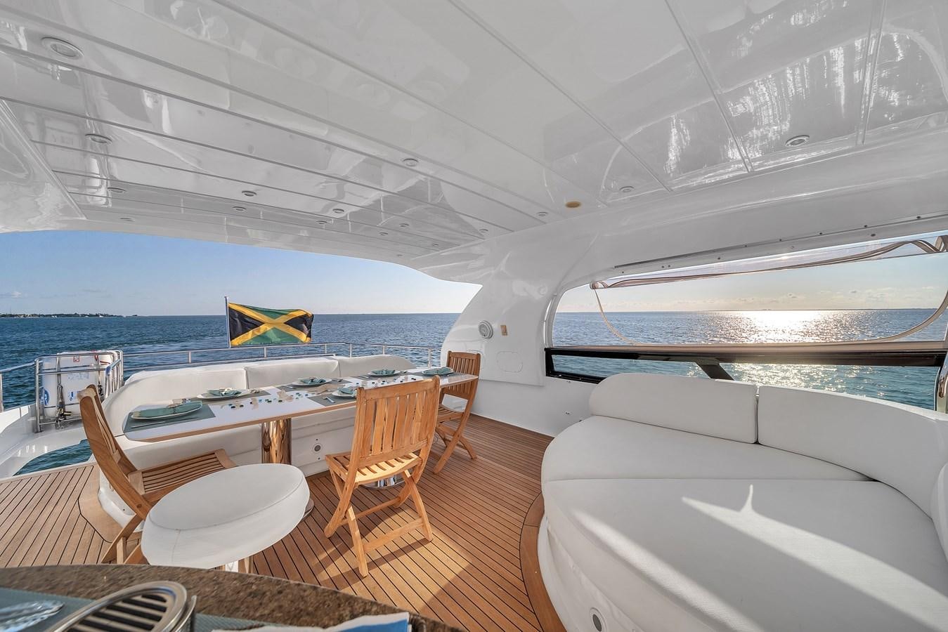 a room with a table and chairs aboard DOMINIC Yacht for Sale