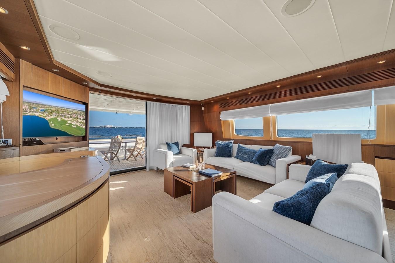 a room with a couch and a television aboard DOMINIC Yacht for Sale