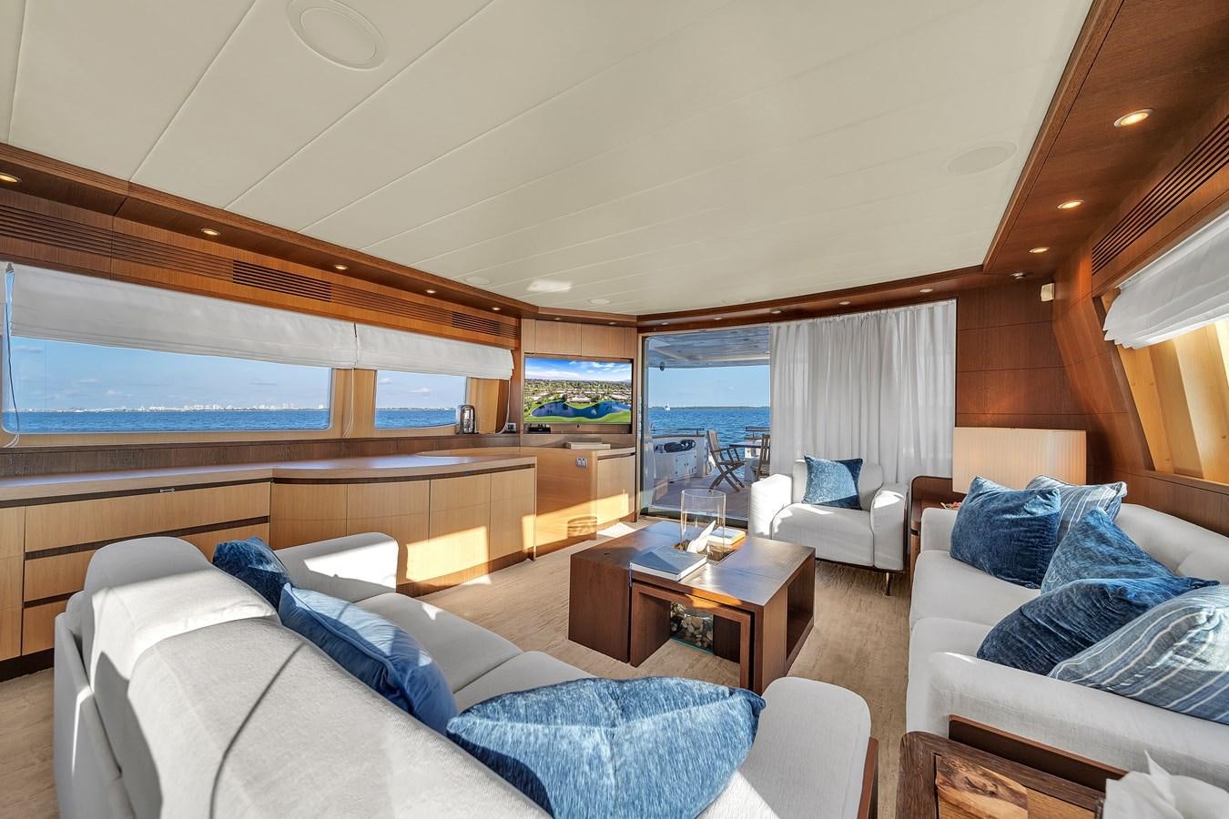 a room with a bed and a table aboard DOMINIC Yacht for Sale