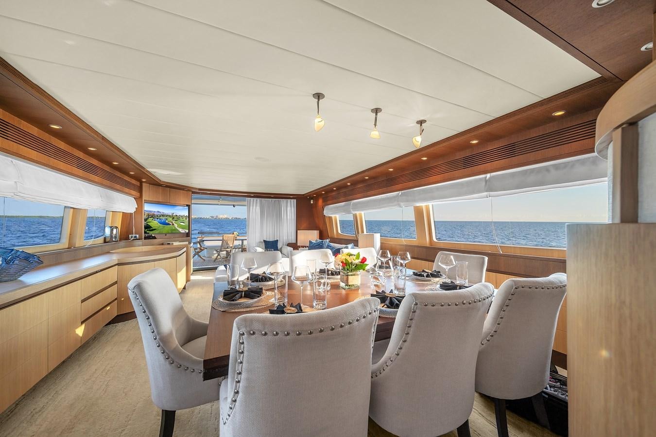 a dining room with a large table aboard DOMINIC Yacht for Sale