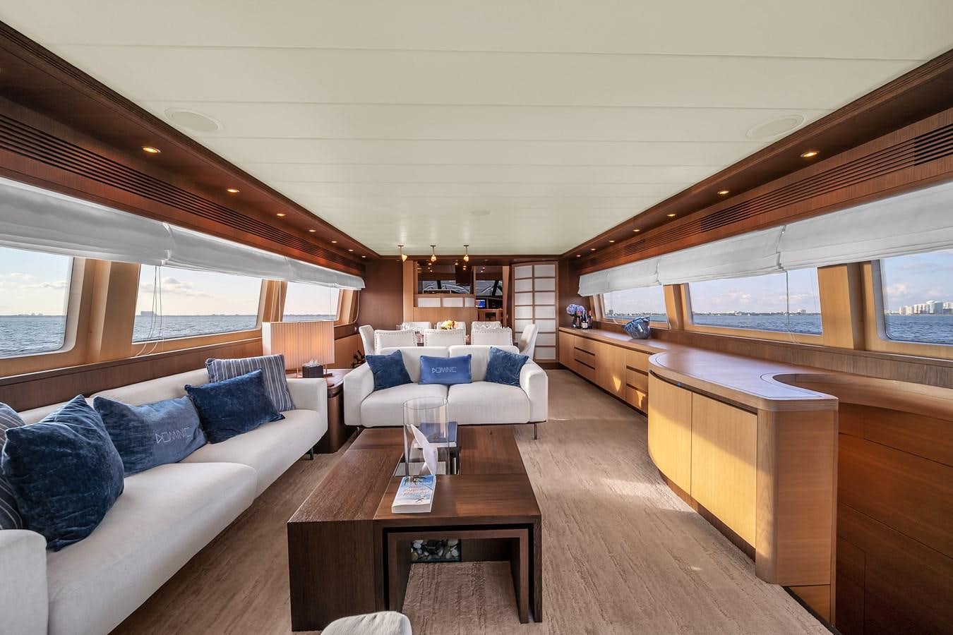 a living room with a couch and a table aboard DOMINIC Yacht for Sale