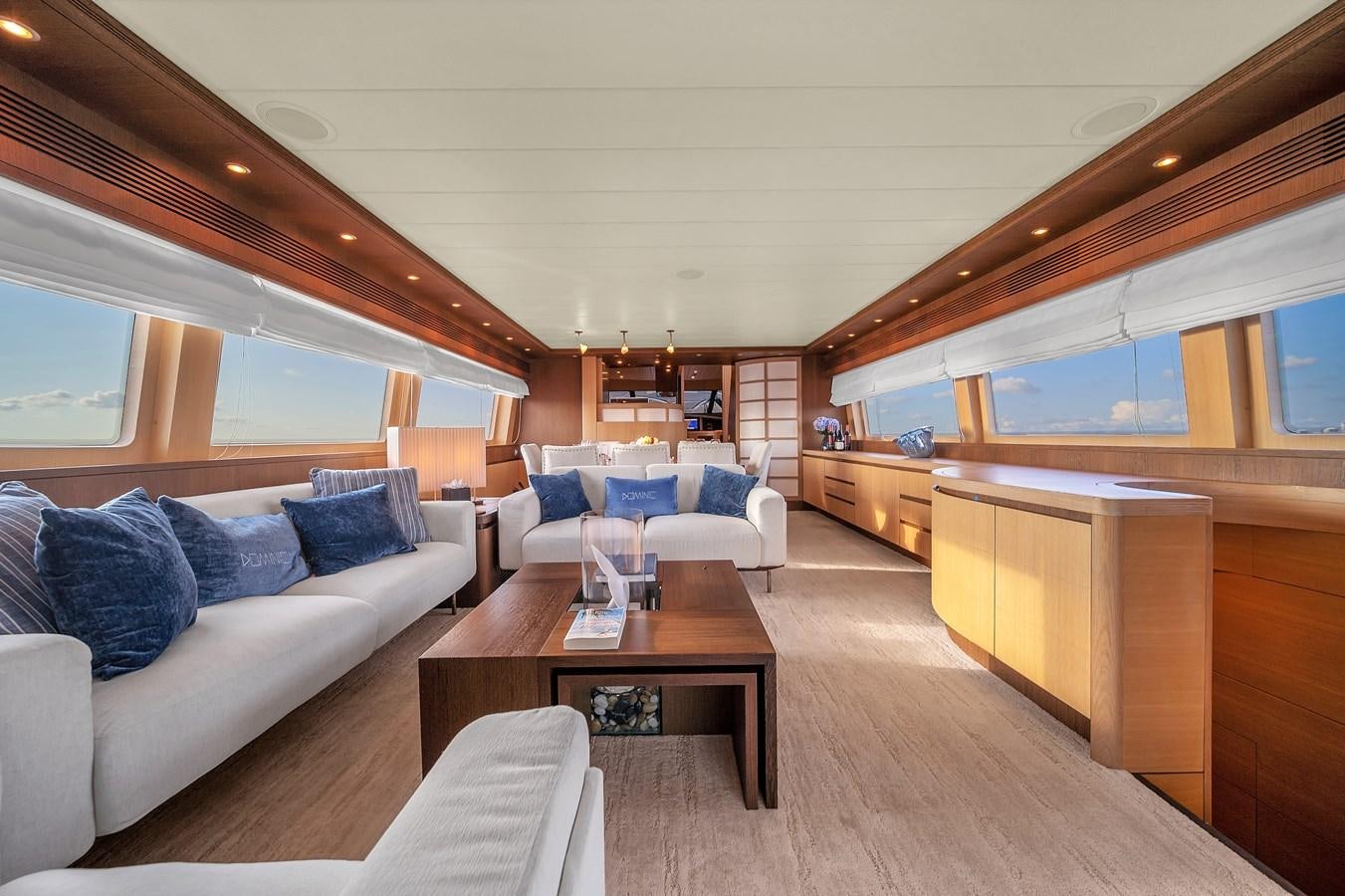 a living room with a couch and a table aboard DOMINIC Yacht for Sale
