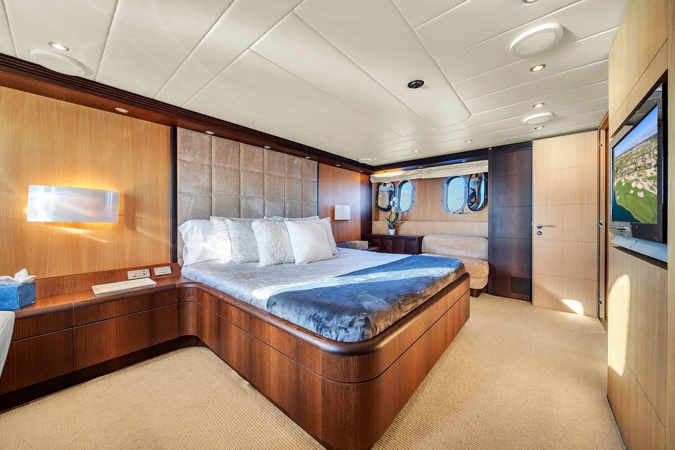 a room with a bed and a tv aboard DOMINIC Yacht for Sale