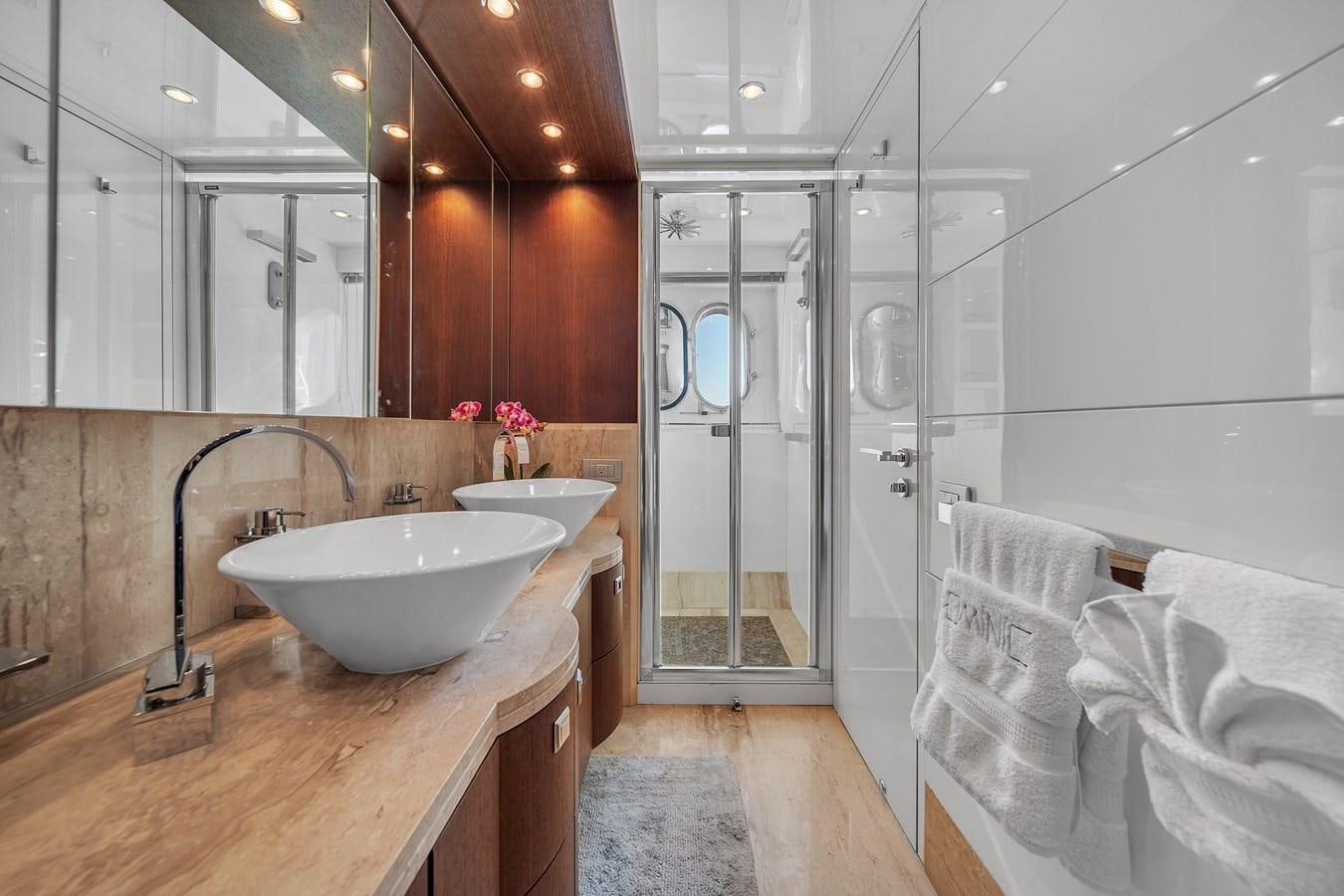 a bathroom with a sink and a shower aboard DOMINIC Yacht for Sale