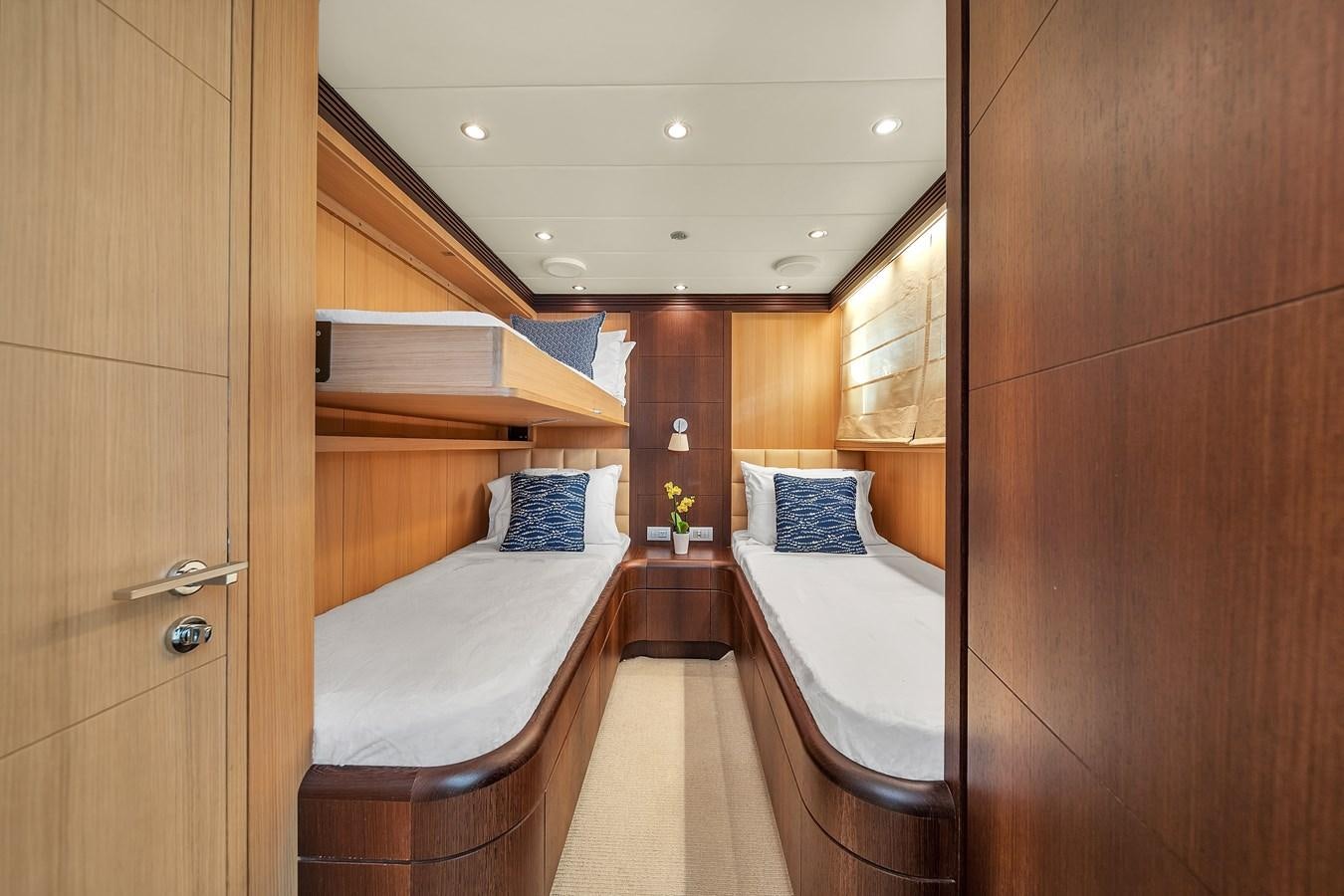 a room with a bed and a closet aboard DOMINIC Yacht for Sale