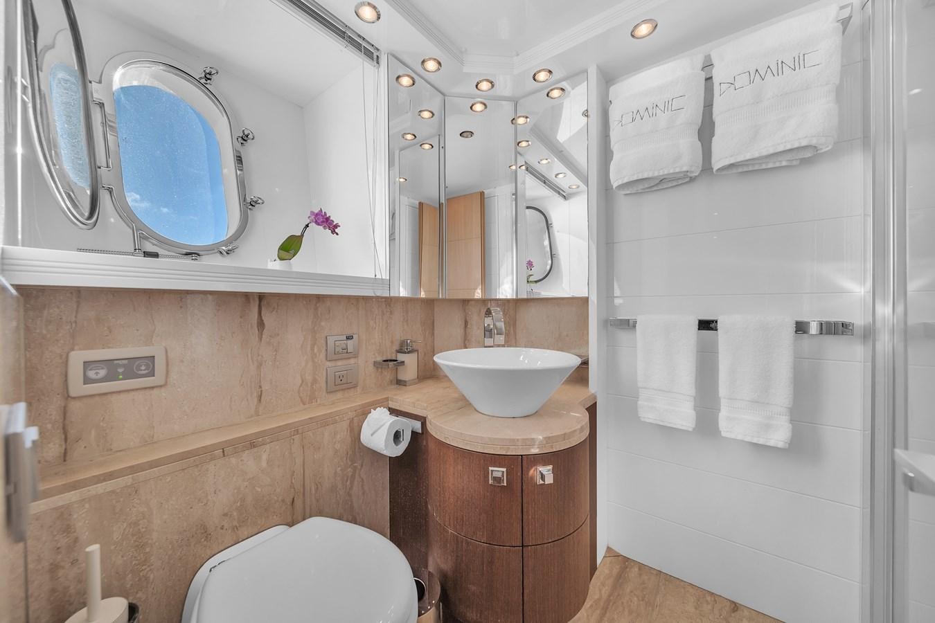 a bathroom with a sink and toilet aboard DOMINIC Yacht for Sale