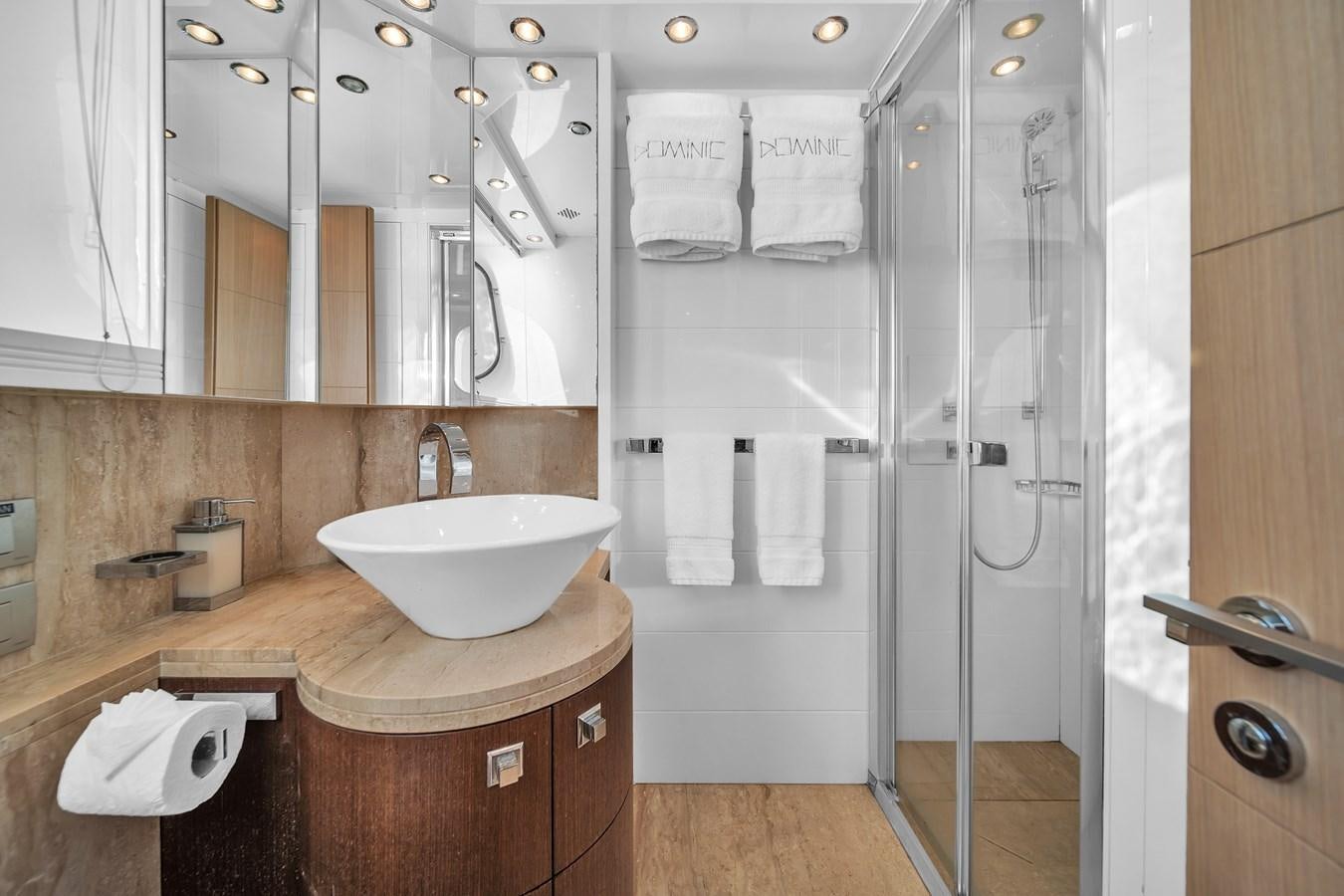 a bathroom with a sink and a shower aboard DOMINIC Yacht for Sale
