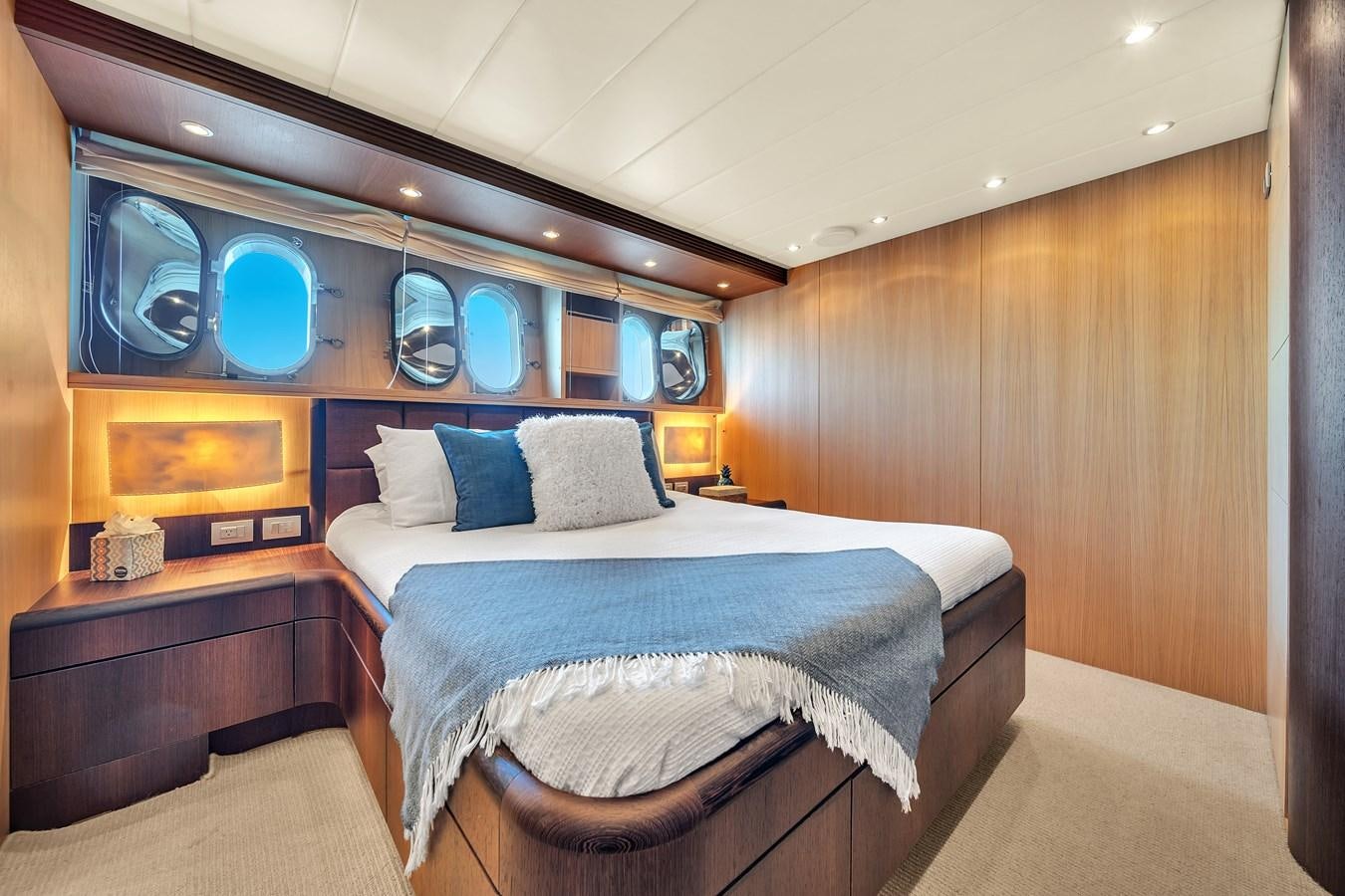 a room with a bed and a desk aboard DOMINIC Yacht for Sale