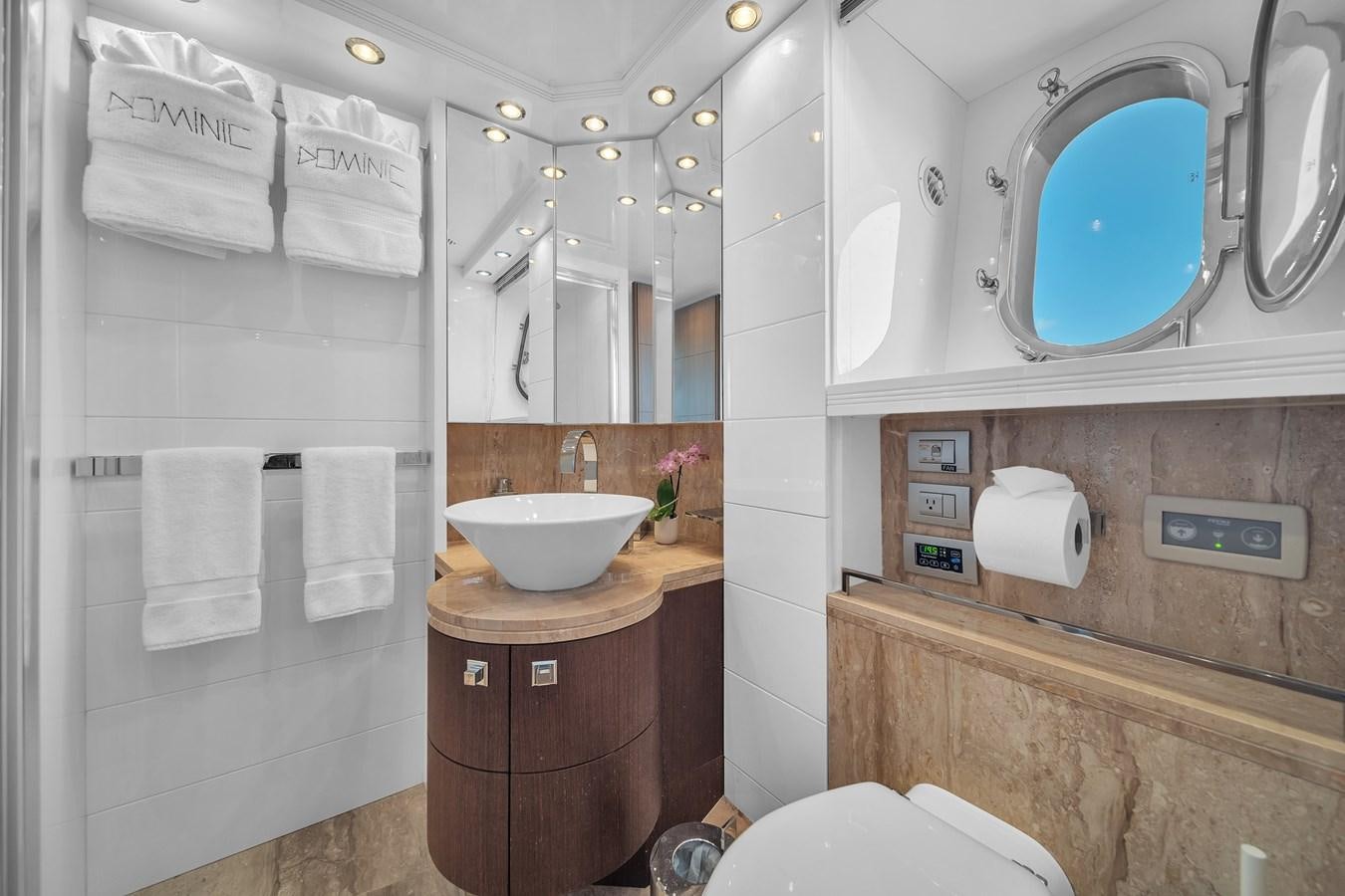 a bathroom with a sink and toilet aboard DOMINIC Yacht for Sale