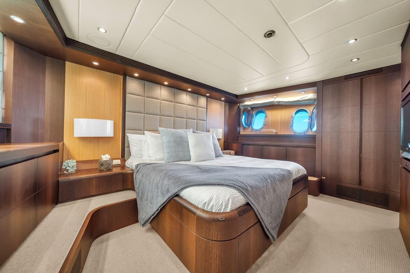 a room with a bed and a window aboard DOMINIC Yacht for Sale