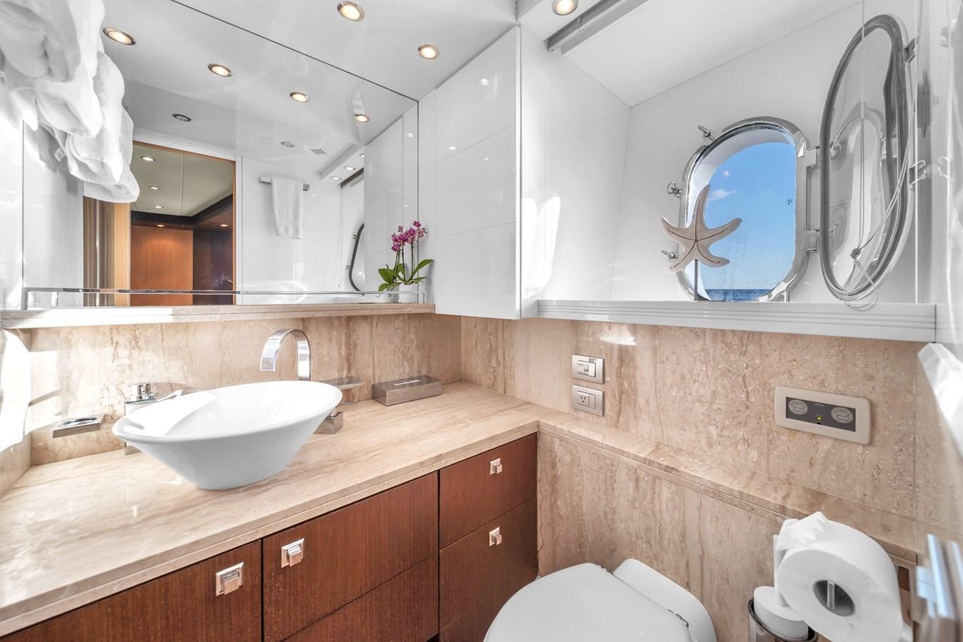 a bathroom with a large mirror aboard DOMINIC Yacht for Sale