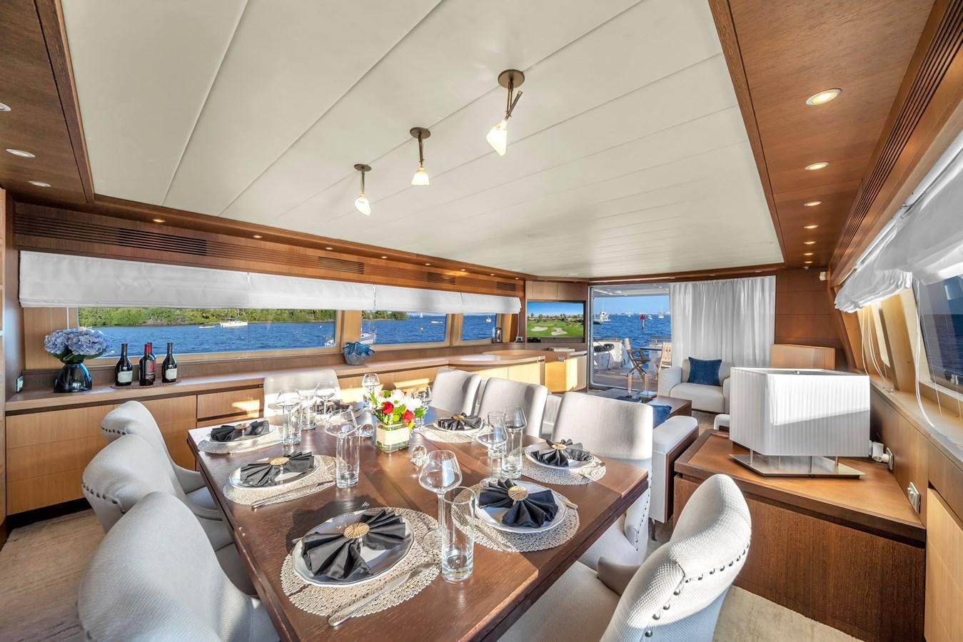 a room with a table chairs and a window aboard DOMINIC Yacht for Sale