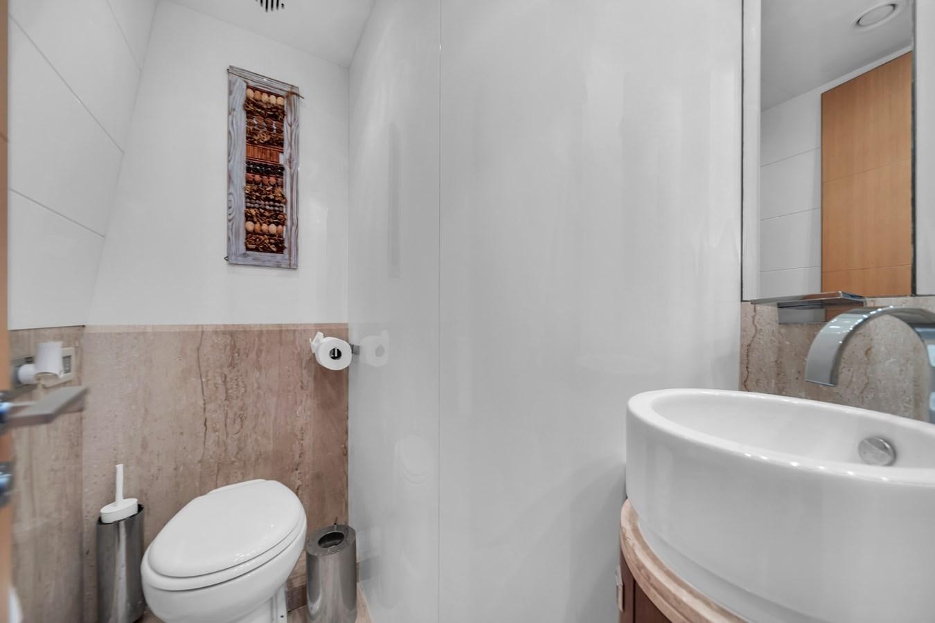 a bathroom with a sink toilet and a bathtub aboard DOMINIC Yacht for Sale