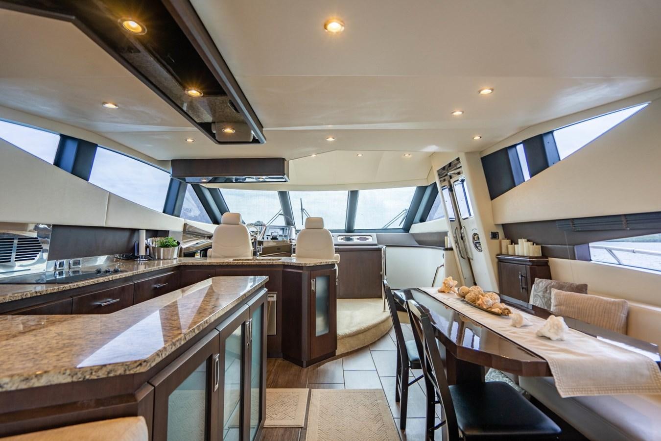 a kitchen with a large window aboard MAYA Yacht for Sale