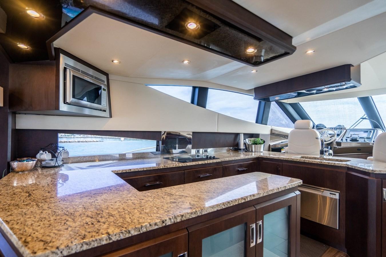 a kitchen with a large island aboard MAYA Yacht for Sale