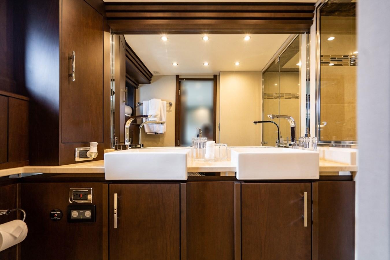 a bathroom with a sink and a mirror aboard MAYA Yacht for Sale