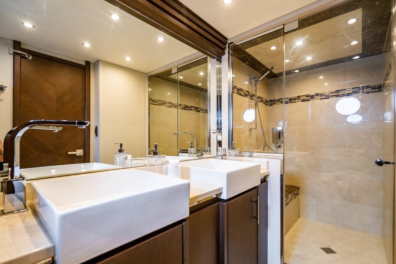 a bathroom with a large mirror aboard MAYA Yacht for Sale