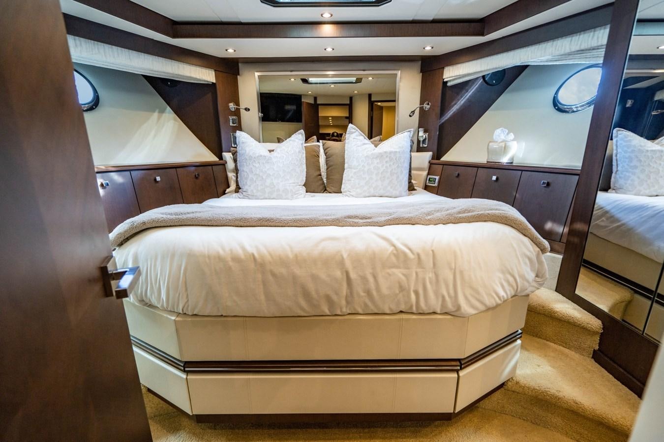 a bed with white sheets aboard MAYA Yacht for Sale