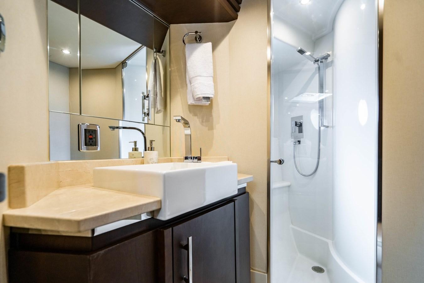 a bathroom with a sink and a mirror aboard MAYA Yacht for Sale