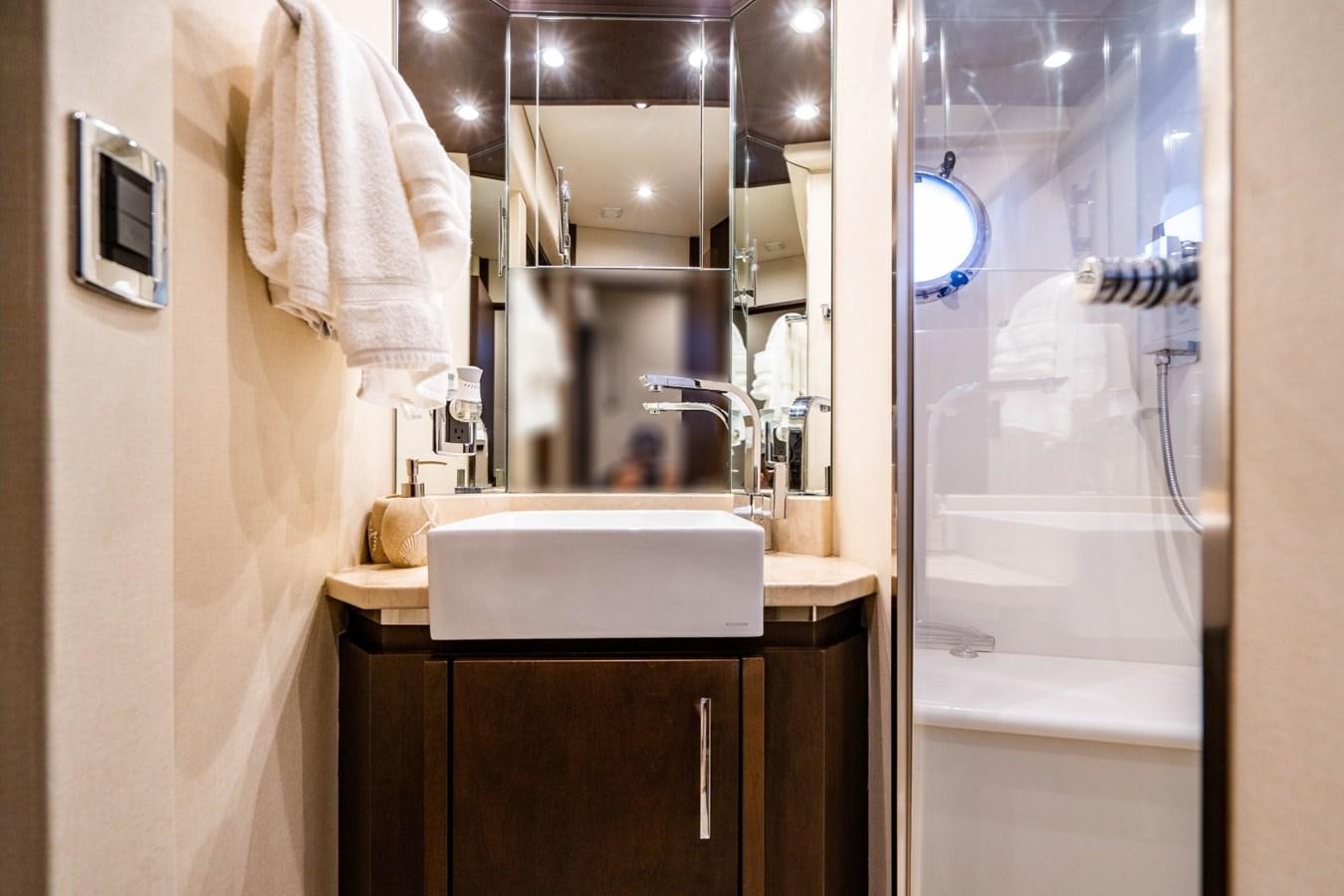 a bathroom with a sink and a shower aboard MAYA Yacht for Sale