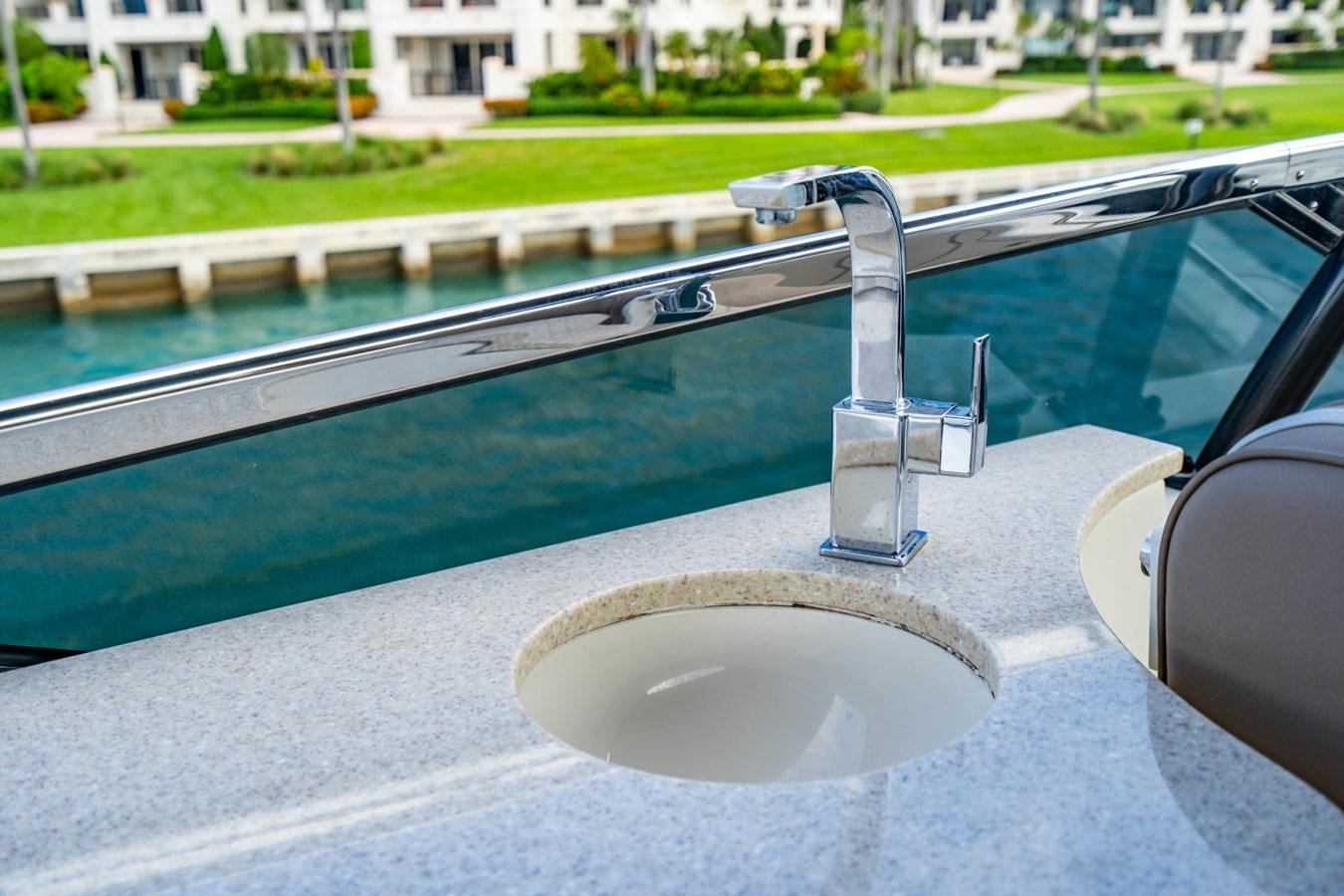 a water slide in a pool aboard MAYA Yacht for Sale