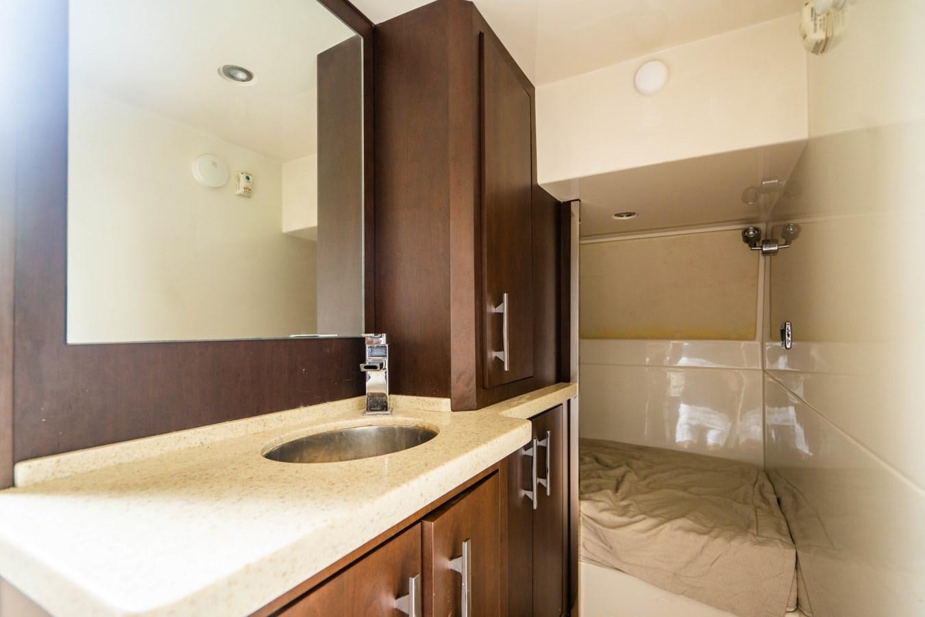 a bathroom with a sink and a mirror aboard MAYA Yacht for Sale