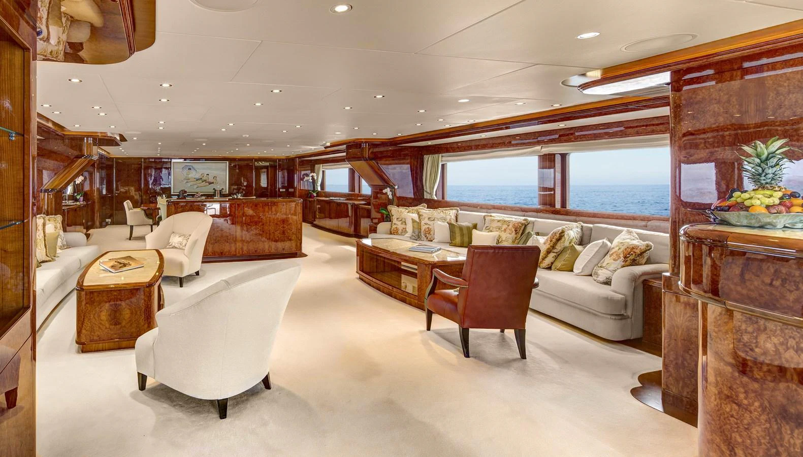 a large room with a couch and a table aboard BARON TRENCK Yacht for Charter