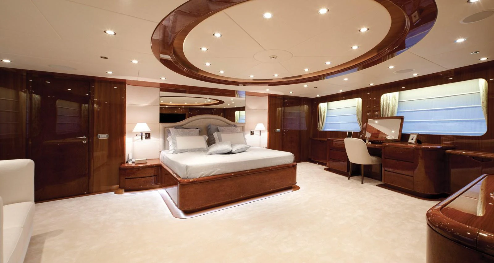 a large hotel room with a large bed and a large television aboard BARON TRENCK Yacht for Charter