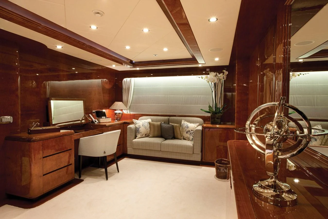 a living room with a large mirror aboard BARON TRENCK Yacht for Charter