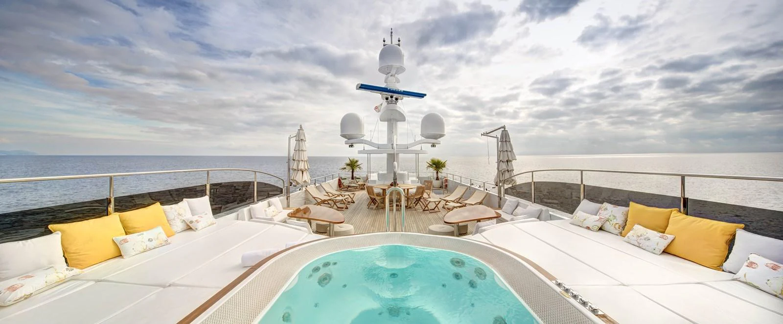 a large white bed with a pool aboard BARON TRENCK Yacht for Charter