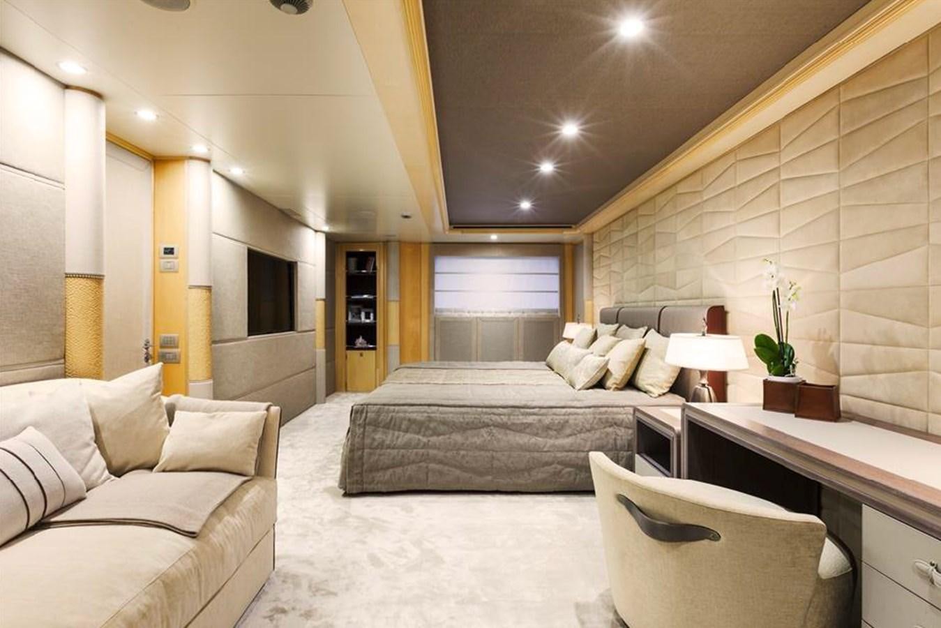 a room with a bed and a chair aboard AMORE MIO 2 Yacht for Sale