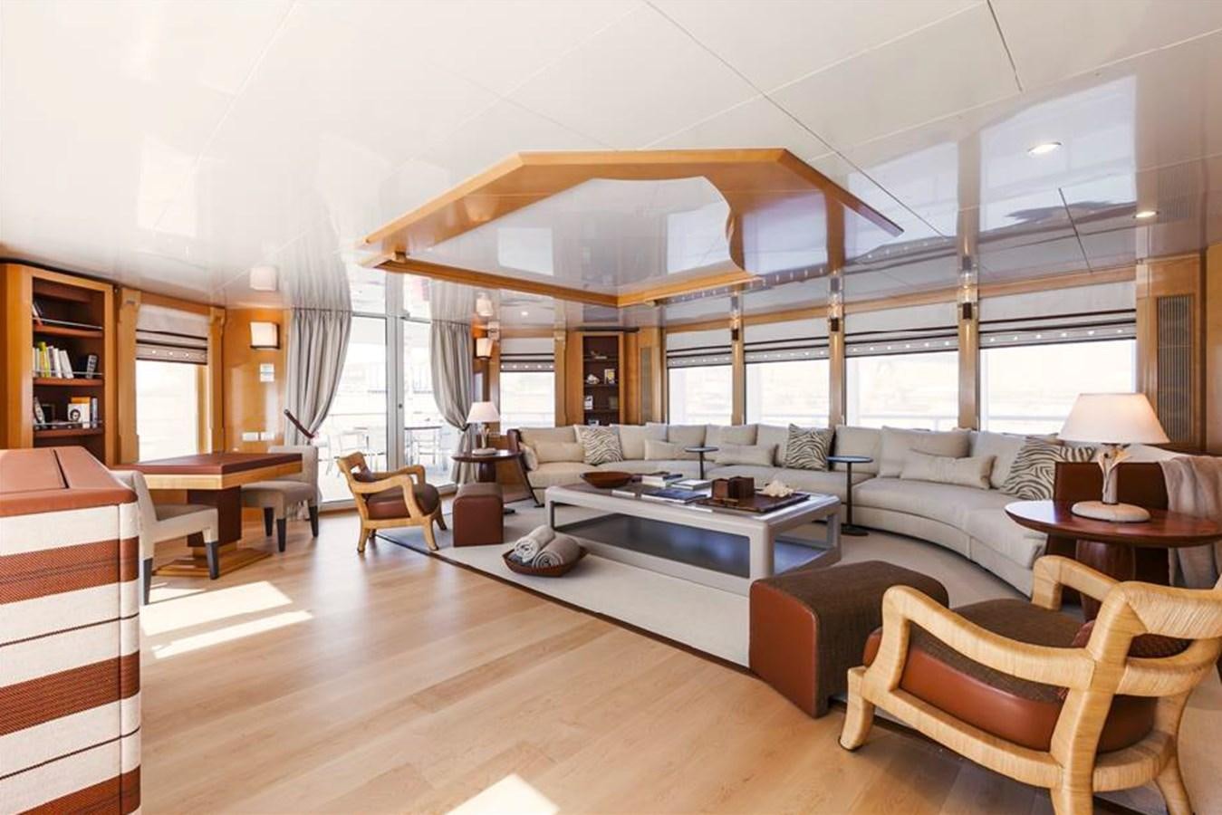 a living room with a large glass table and a large window aboard AMORE MIO 2 Yacht for Sale