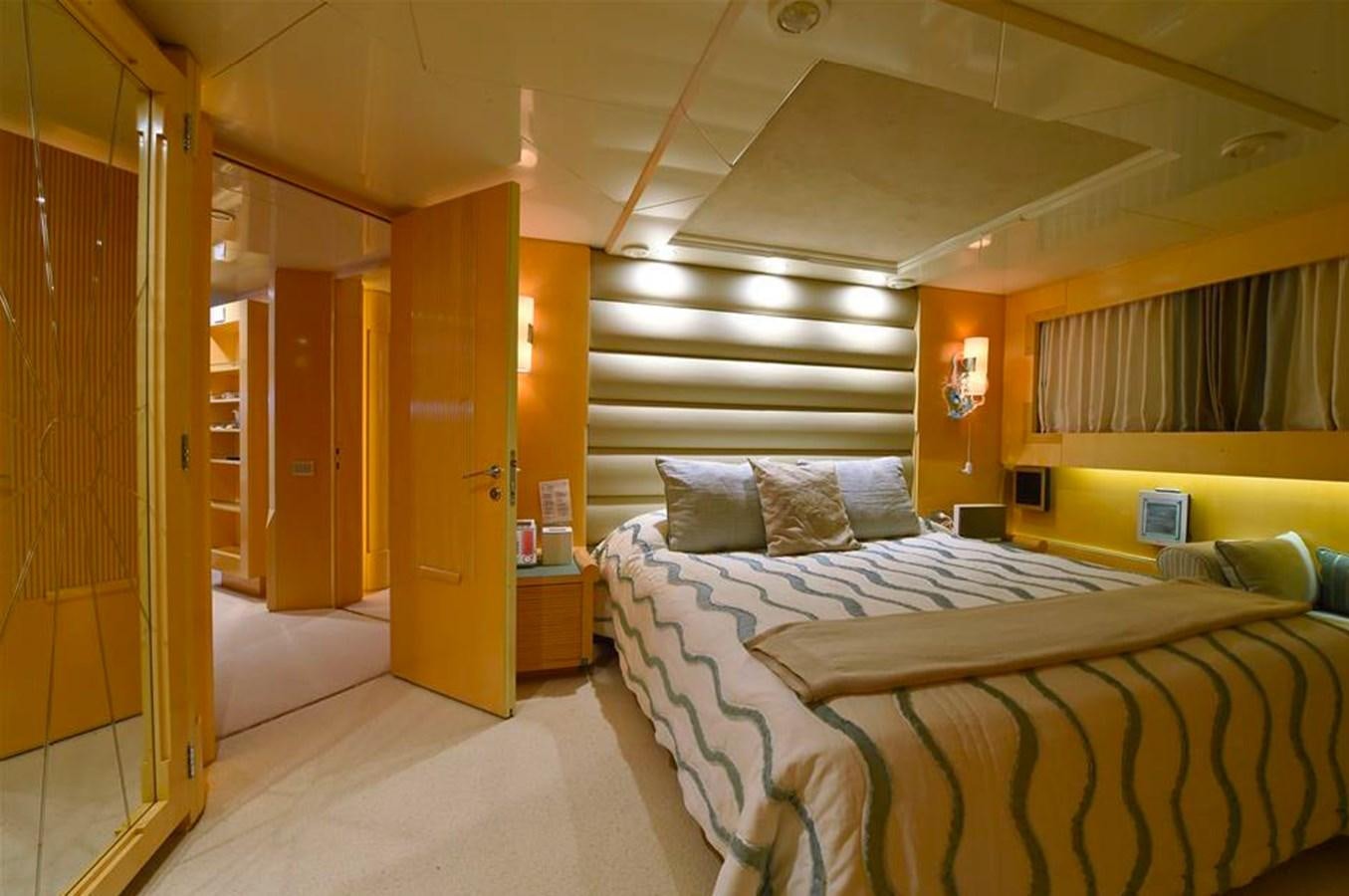 a room with a bed and a door aboard AMORE MIO 2 Yacht for Sale