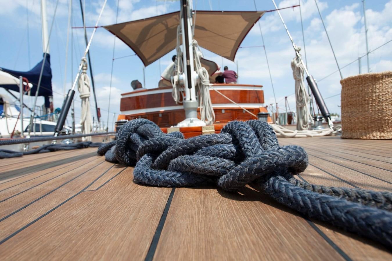 a large alligator on a wood surface aboard LAMADINE Yacht for Sale