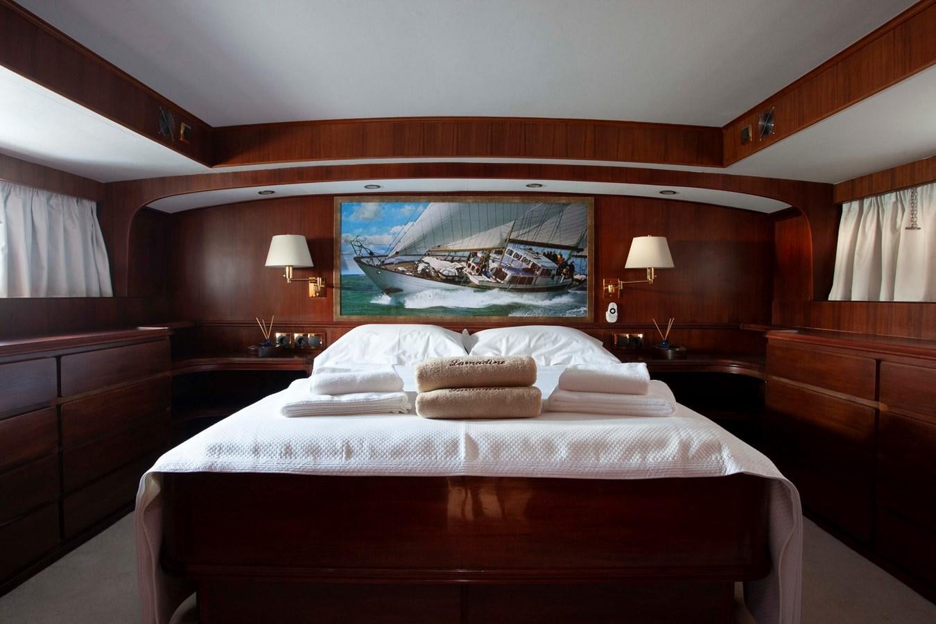 a room with two beds aboard LAMADINE Yacht for Sale