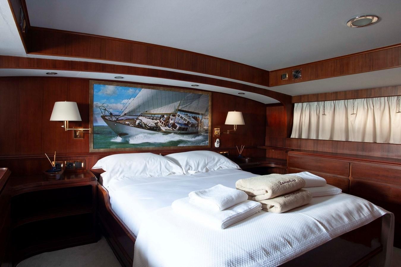 a hotel room with a large bed aboard LAMADINE Yacht for Sale