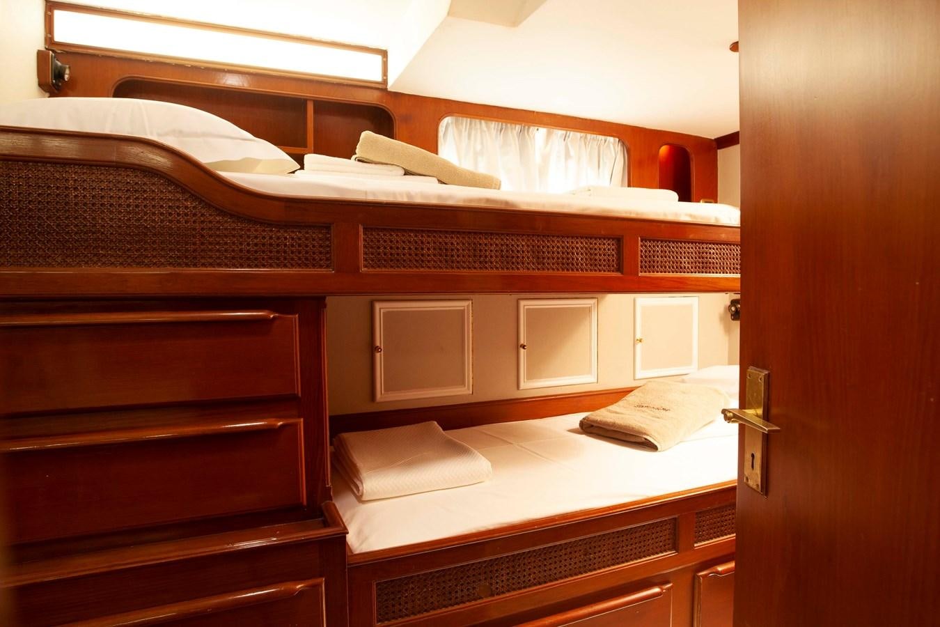 a room with bunk beds aboard LAMADINE Yacht for Sale