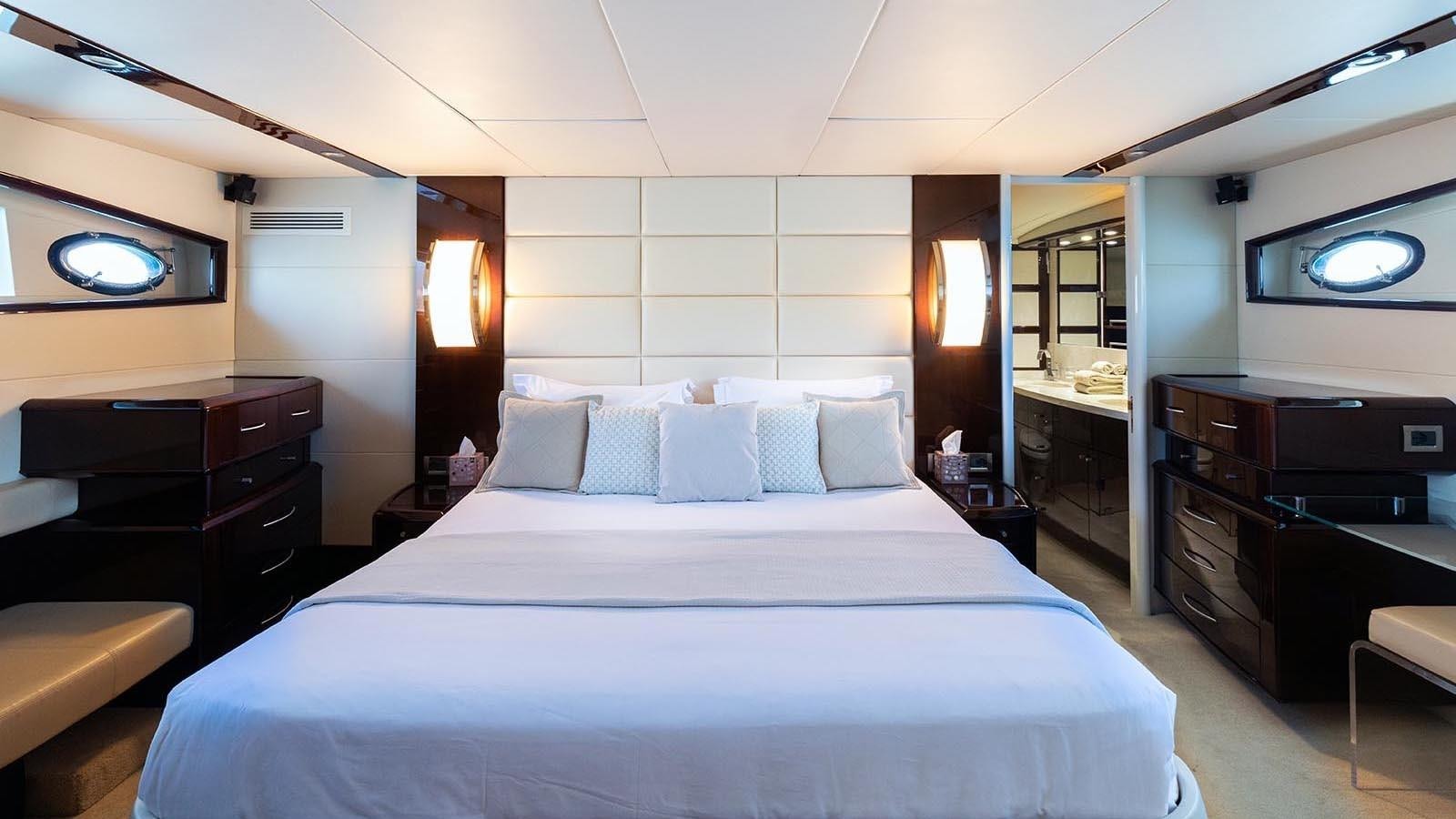 a large bed in a hotel room aboard LIZZI Yacht for Sale