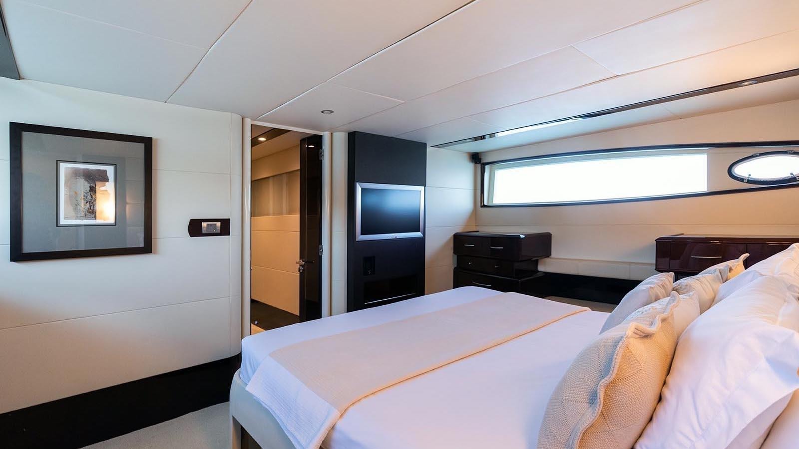 a person lying on a bed aboard LIZZI Yacht for Sale