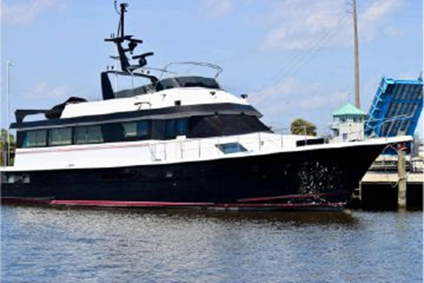 a large boat docked at a pier aboard MAC LL Yacht for Sale