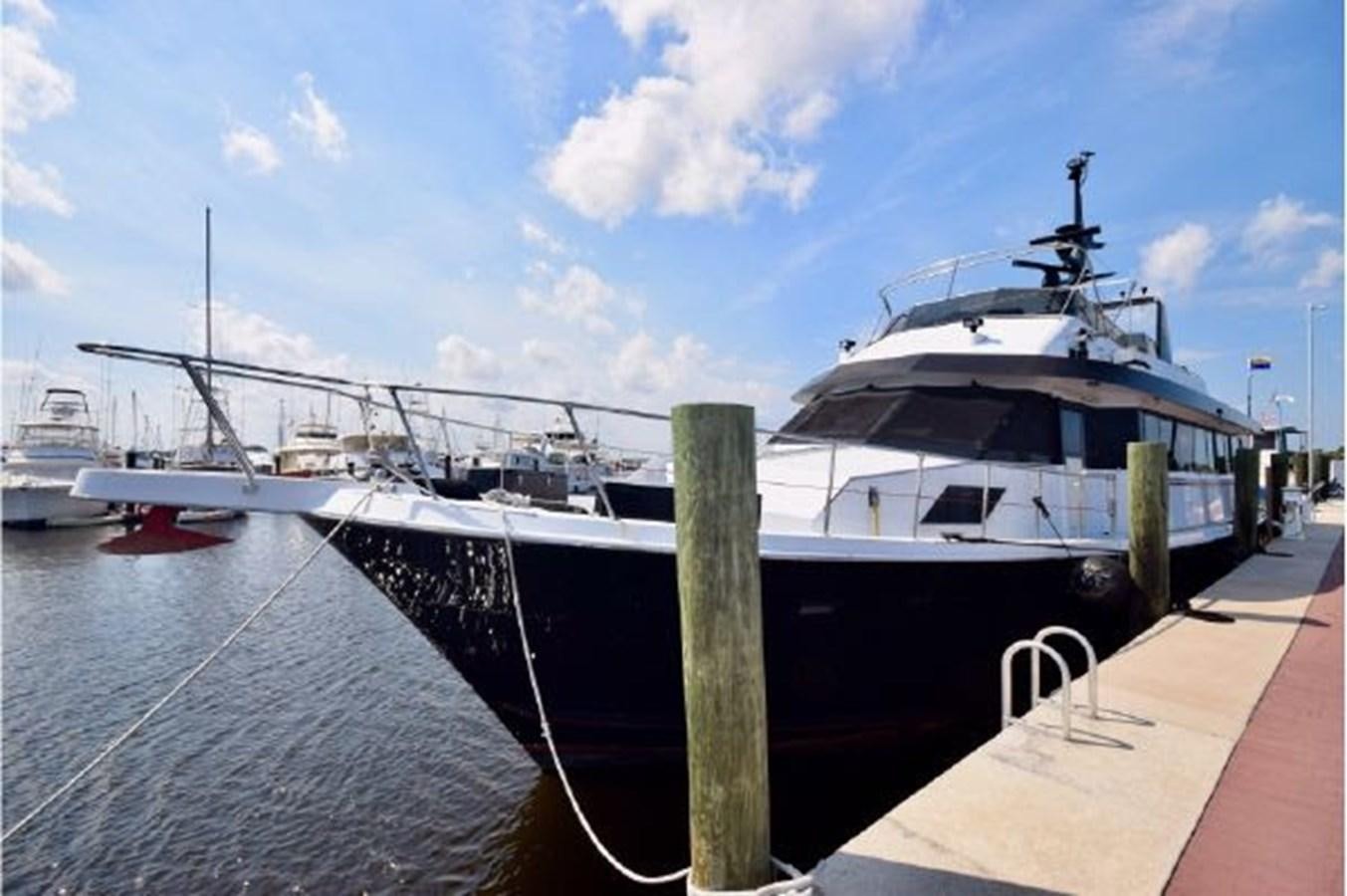 a boat docked at a pier aboard MAC LL Yacht for Sale