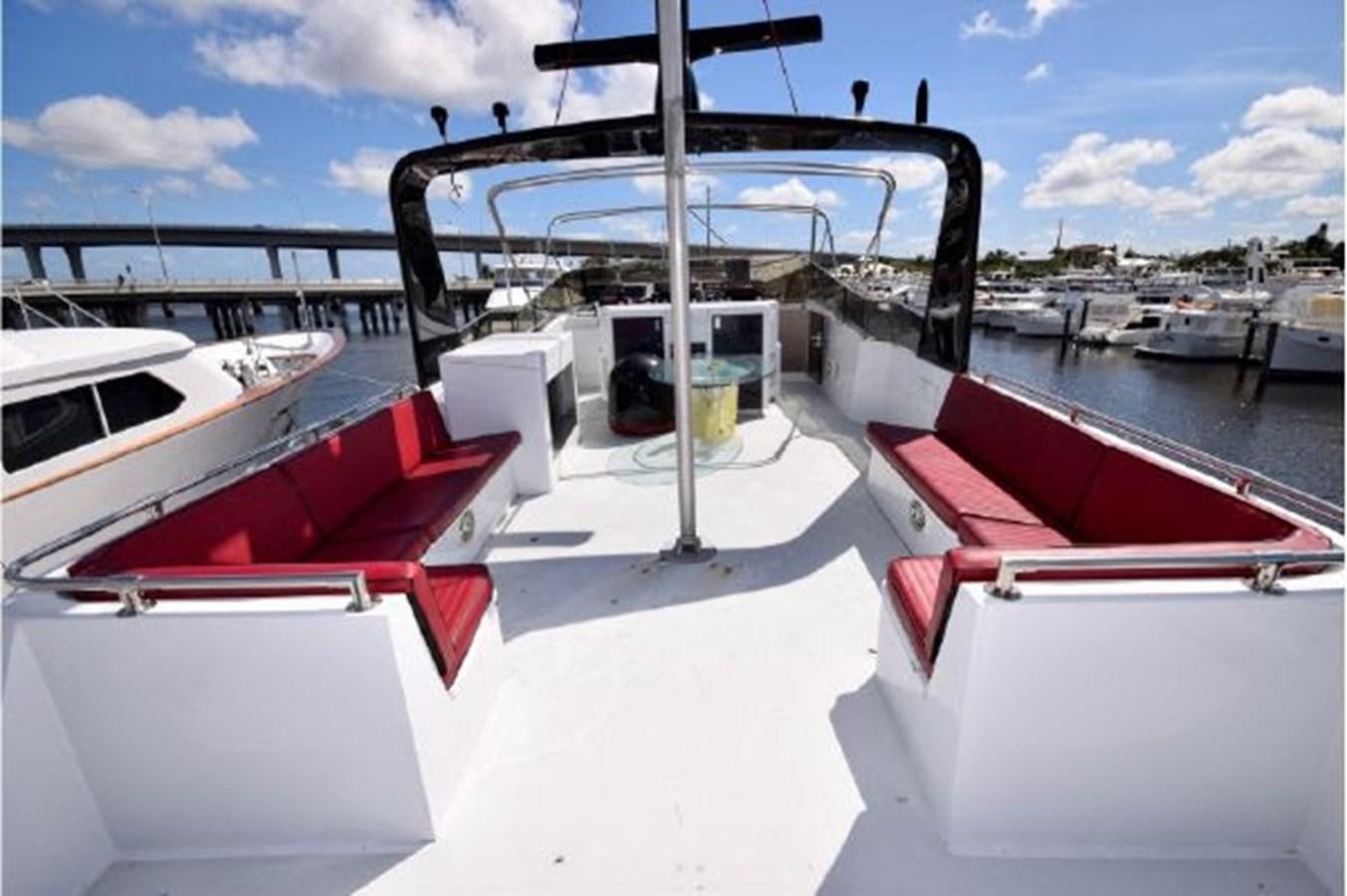 a boat docked at a pier aboard MAC LL Yacht for Sale